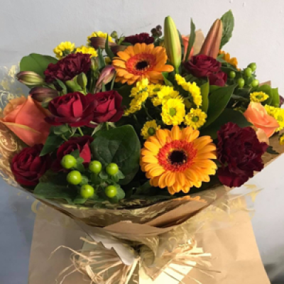 Delight - A mixed bouquet of burnt orange and reds