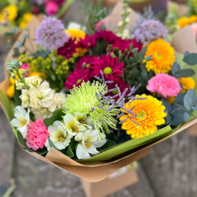 Festival Garden - A vibrant mix of the season’s brightest colours – from lime green spiders to coral carnations and amethyst alliums. A carnival of colour.