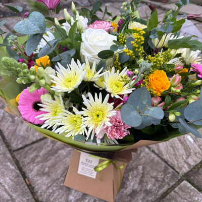 Lemon Fizz - Zesty and bright, this mixed bouquet blends lemon-toned chrysanthemums, gerberas, roses and snapdragons with soft pinks and purples for a citrusy spring feel.