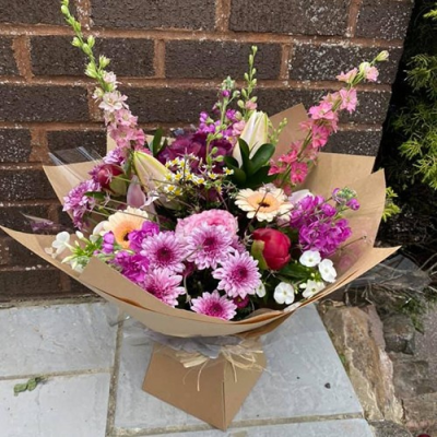 Pretty In Pink - A beauitful handtied with seasonal flowers in shades of pink with complimentary foliage. Hand delivered Wellington and surrounding areas by Bloomin Lovely.